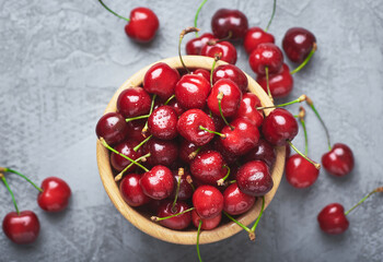 Naklejka na ściany i meble Fresh cherry fruit. Fresh red cherries fruit on table.