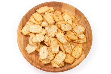 Top view of savory onion crackers on the wooden dish