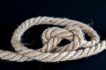coarse linen fiber rope on a wooden board