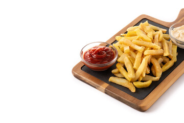Fried potatoes with ketchup and Mayonnaise isolated on white background. Copy space