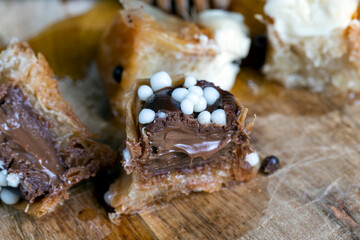 sweets made of thin puff pastry with chocolate filling and honey