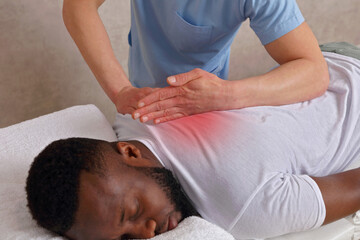 Chiropractic treatment, Back pain relief. Physiotherapy for male patient.