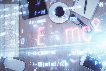 Double exposure of formula drawing over table with phone. Top view. Education concept.
