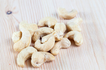 cashew nuts lying on a white board