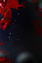 Deep red solid splashes of dried ink suspended in water and surrounded by small bubbles - abstract deep space concept - splatter that looks like blood and grunge