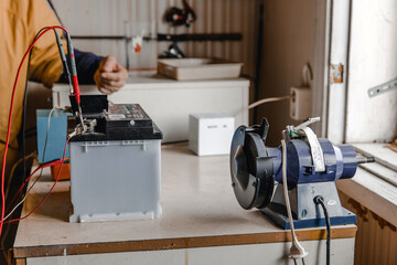 Mechanic doing service on electric car battery