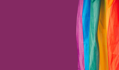 The rainbow flag or LGBT on a purple background