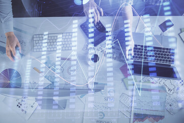 Plakat Multi exposure of man and woman working together and financial chart hologram. Business concept. Computer background.