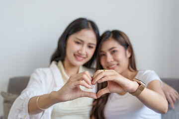 lgbtq, lgbt concept, homosexuality, two Asian women posing happy together and showing love for each other while being together