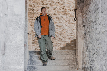 A male tourist explores the old town in the city of Tallinn in Estonia