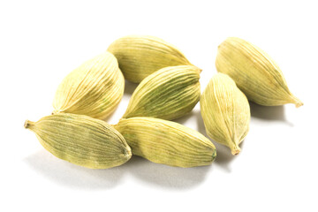 Spice green cardamom (Elettaria cardamomum) pods in bunch on white background isolated. Close up. Healthy eating concept