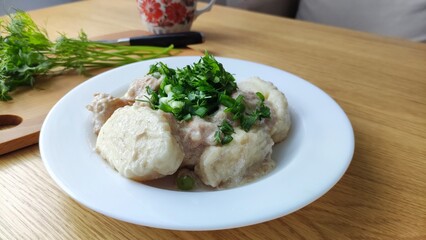 dumplings with meat and sauce