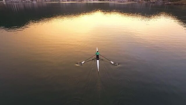 Rower training on sunset