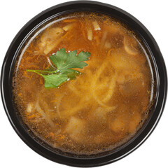 Fresh soup in disposable round plastic black bowl top view on white background