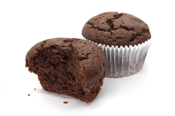 Chocolate muffins with napkin and half-eaten on the white background