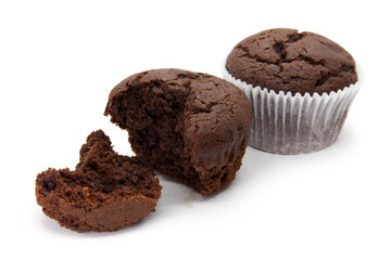 Chocolate muffins with napkin and two half on the white background