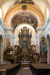 Fototapeta na wymiar Interior of baroque church with beautiful altar, Vrchlabi, Czechia