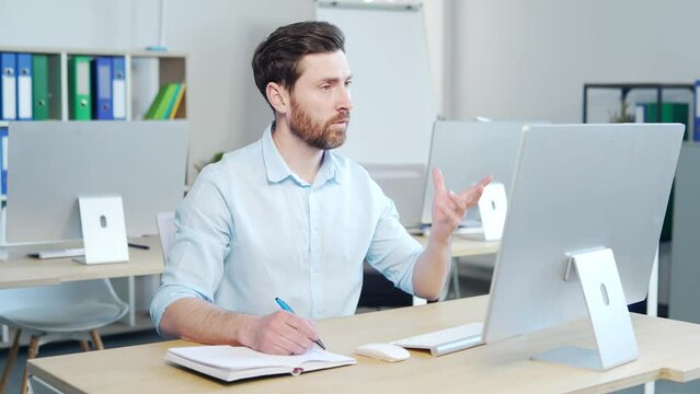 Business man employee online learning in office. hr manager having distance webcam chat job interview on computer. writing notes listening lecture, consulting, taking web course training class