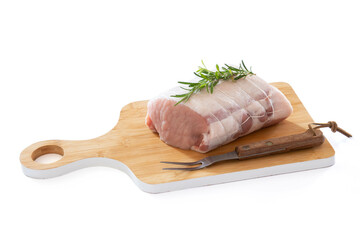 raw pork roast on a board on a wooden background
