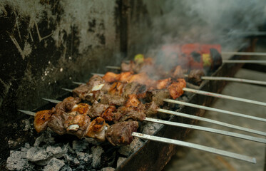 Lamb shish kebab is grilled on a barbecue open fire or rather hot ashes
