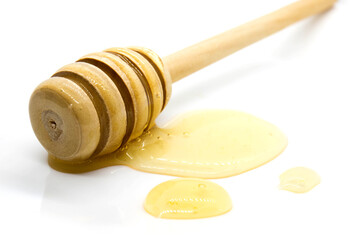  Honey dipper and honey drops - close up