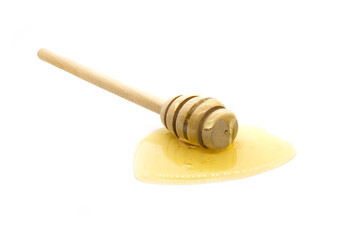 Honey dipper and honey on white background