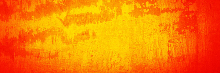 Yellow orange red grunge texture. Toned rough wall surface. Vintage background with space for...