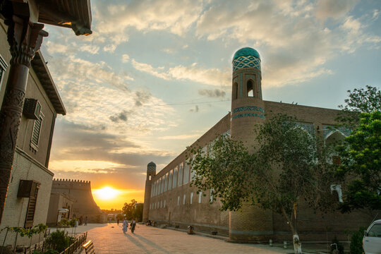 Sunset in old   town of   old Khiva   and blue-green heads of Minarets