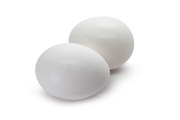  Set of two white eggs on the white background