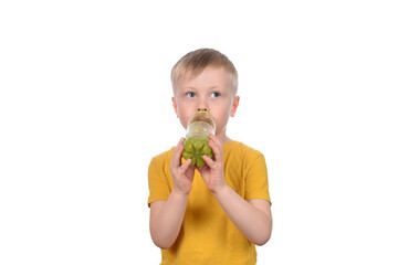 cut boy drinking fresh fruit juice