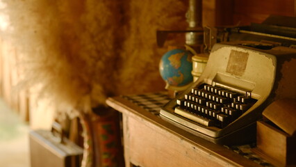 old typewriter on the table of decoration vintage room