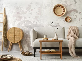 Peel and stick wall murals Boho Style The stylish ethnic composition at living room interior with grey sofa, colorful wicker, rattan sideboard, bench and elegant personal accessories. Grey concrete wall. Cozy apartment. Home decor.