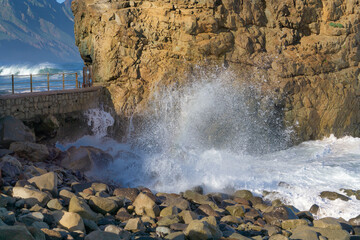 Fototapeta premium The rough Atlantic Ocean near Tenerife, Spain, strong waves break on the rocks in the water