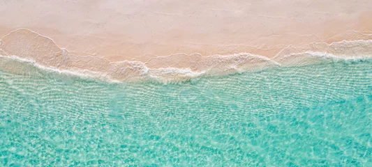 Foto op Canvas Relaxing aerial beach scene, summer vacation holiday template banner. Waves surf with amazing blue ocean lagoon, sea shore, coastline. Perfect aerial drone top view. Peaceful bright beach, seaside © icemanphotos