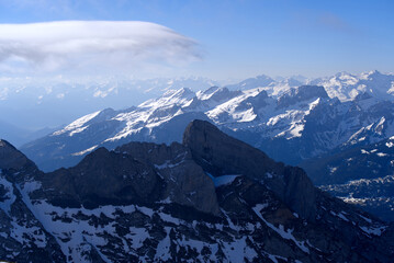 Aerial view over the Swiss Alps seen from Säntis peak at Alpstein Mountains on a sunny spring day. Photo taken April 19th, 2022, Säntis, Switzerland.