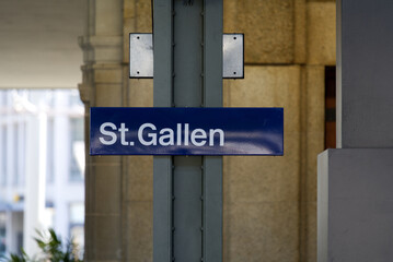 Main railway station of City of St. Gallen with blue sign on a sunny spring day. Photo taken April 19th, 2022, St. Gallen, Switzerland.