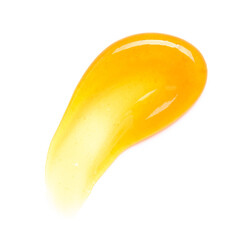 Transparent yellow gel cream smear smudge with bubbles macro isolated on white background top view