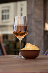 glass of wine and chips 