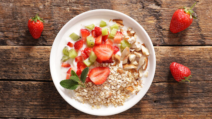 bowl of oat,  yogurt,  fruit and almond