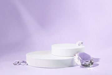 White podium with diamonds on a lilac background.