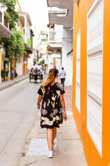 rear view of a latina woman walking in te historic center of Cartagena Colombia