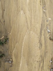 The texture of clay and sand after the rain. Close-up.