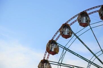 part of the Ferris wheel against the blue sky. Attraction. geometric background