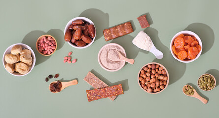 healthy snack, home made energy bars, superfood protein bars with ingredients, top view. nuts and...