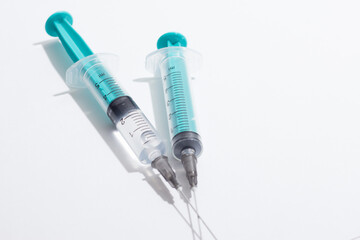 Medical syringe on a white background. A syringe for injection. The concept of health and beauty