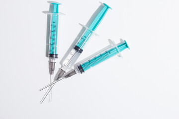 Obraz premium Medical syringe on a white background. A syringe for injection. The concept of health and beauty