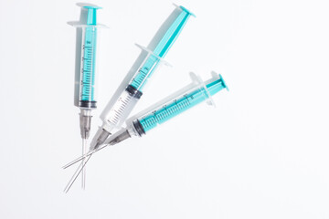 Medical syringe on a white background. A syringe for injection. The concept of health and beauty