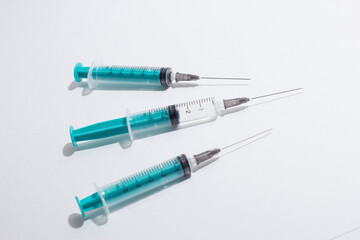 Medical syringe on a white background. A syringe for injection. The concept of health and beauty