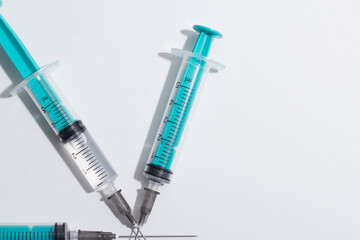 Medical syringe on a white background. A syringe for injection. The concept of health and beauty