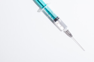 Medical syringe on a white background. A syringe for injection. The concept of health and beauty